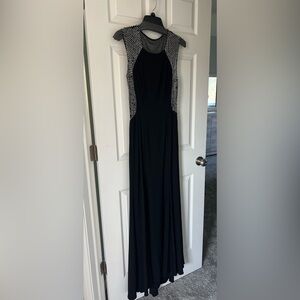Beautiful floor length gown. Black with rhinestones.. side zip closure.